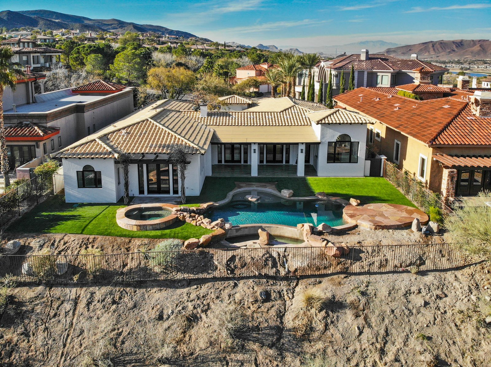 Aerial drone photo of a Las Vegas property and surrounding neighborhood